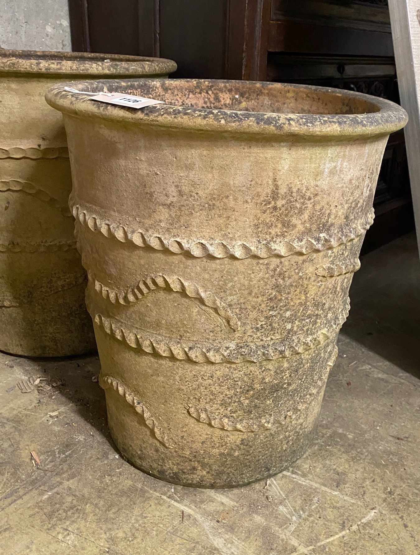 A pair (in 2 sizes) of circular earthenware garden planters, larger height 51cm